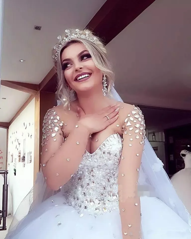 2018-luxury-crystals-beaded-ball-gown-wedding-dresses-sheer-neck-sweetheart-neck-long-sleeve-tulle-princess-plus-size-bridal-gowns.webp (2)_