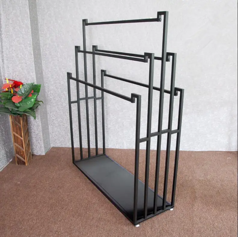 

Cloth display racks are hung on both sides of the double-sided scarves rack