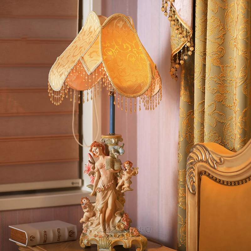 

Moden Art Beautiful Lady Holding Book With Two Angel Boys Holding Horns Statue Table Lamp For Bedroom Bedside Living Room Lamp