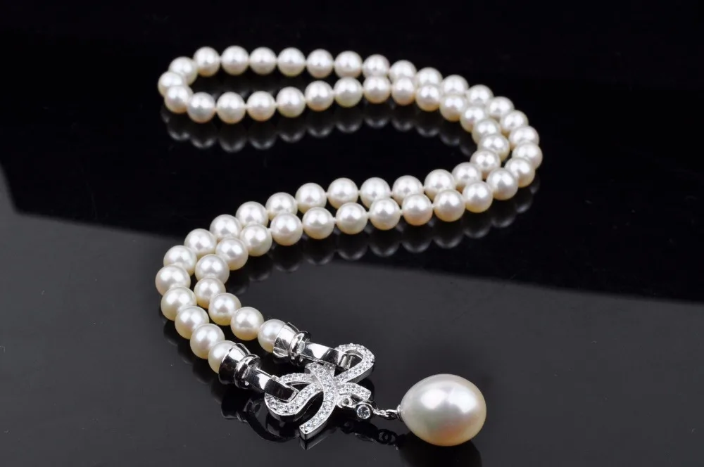 

shitou 001288 Lovely 7-8MM AAAA white pearl necklace with butterfly pearl pendant