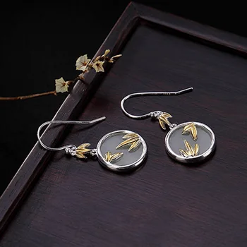 

S925 sterling silver inlaid Hetian white natural stone leaves personality women's earrings
