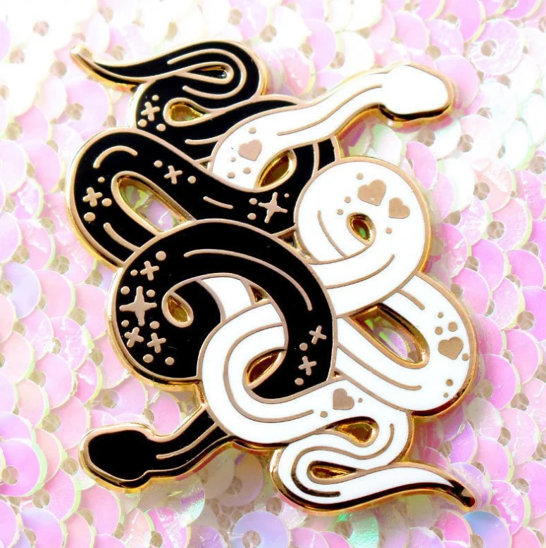 

Black and white snake enamel pin