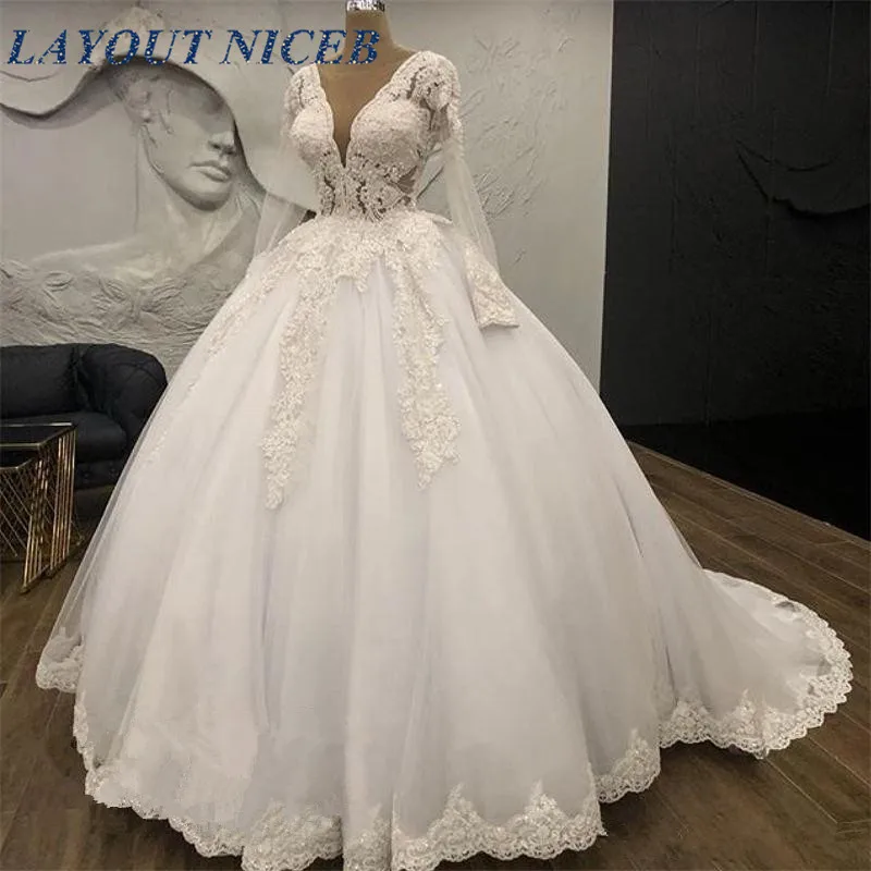 Designer Sheer Long Sleeves Wedding Dress With Appliques 2019 White Puffy Ball Gown Deep V Neck Bridal Dresses For Women