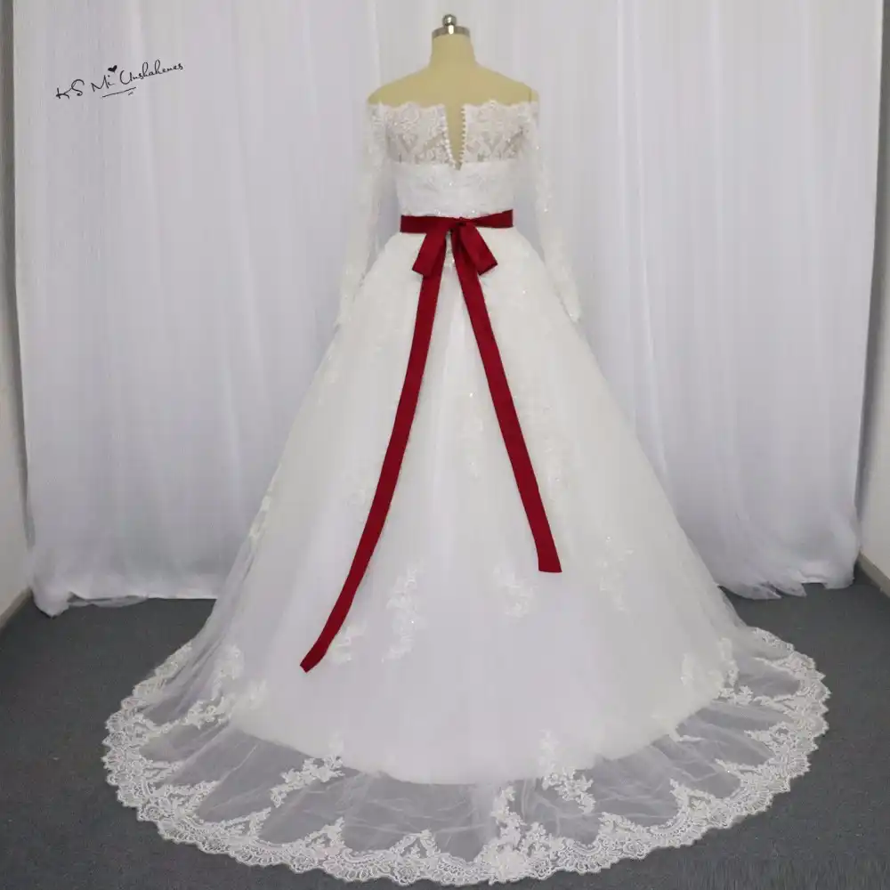 white wedding dress with red sash
