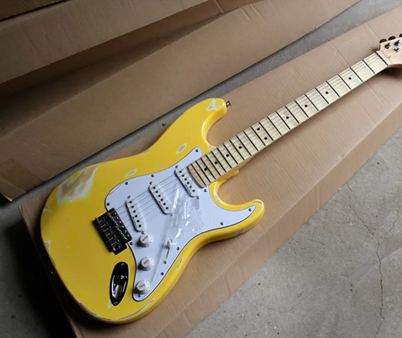 

Factory custom retro yellow body electric guitar with grooved neck,3 pickups,white pickguard,chrome hardware,can be customized.