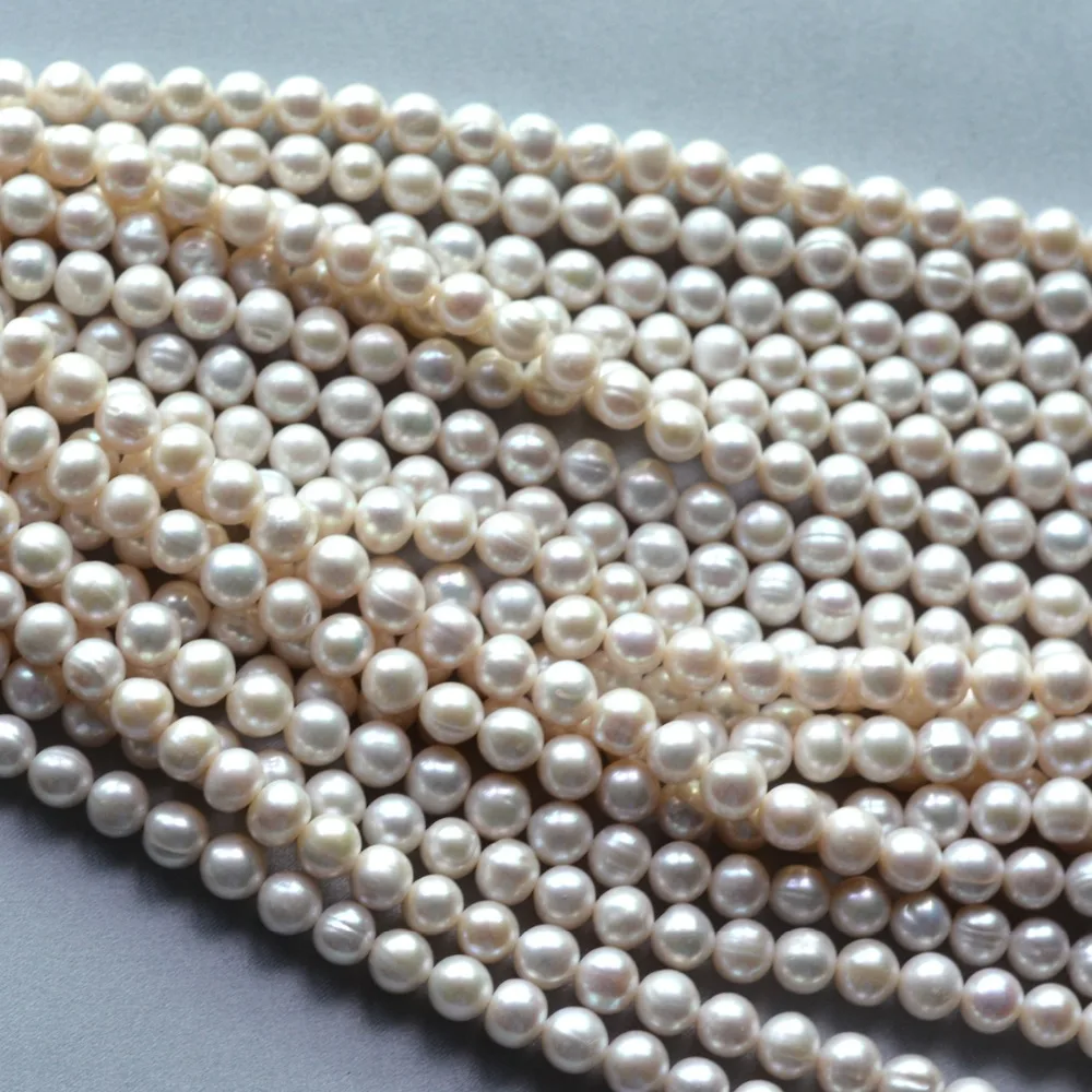 Wholesale Natural Stone Beads 9 10 Nearround Freshwater Pearls Cultred