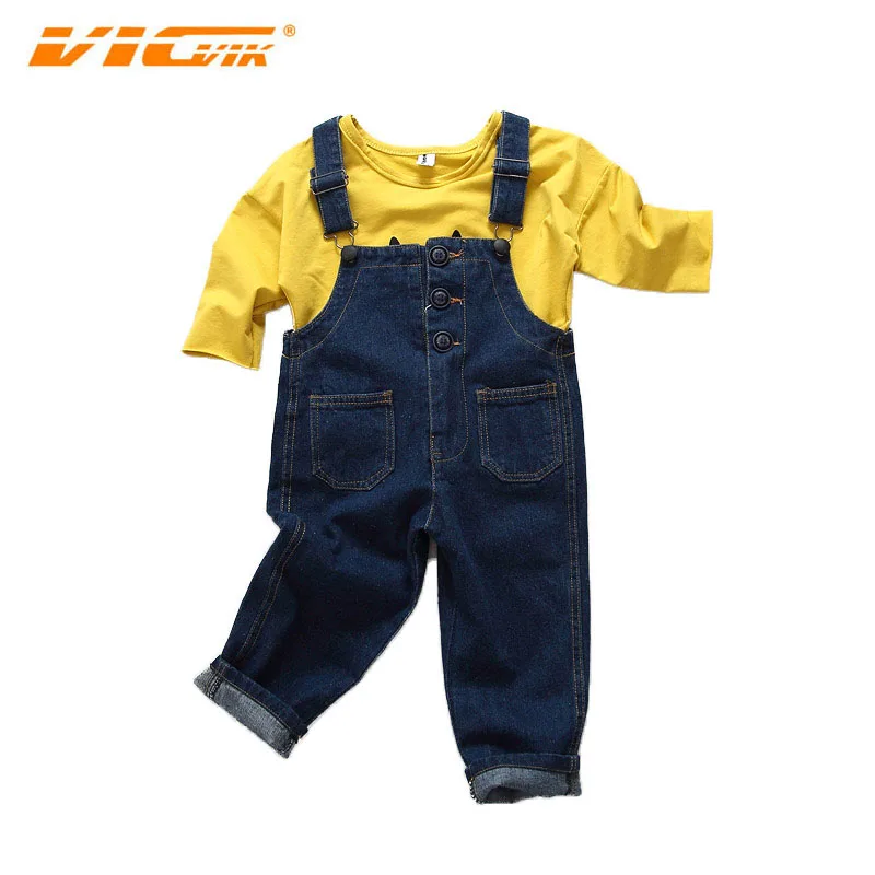 yellow baggy overalls