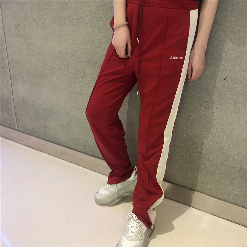 

19SS AMBUSH WAVES TRACK PANTS AMBUSH Logo Embroidery Men Ambush Sweatpants Spring Summer Sports Casual Sides Line Red Pants