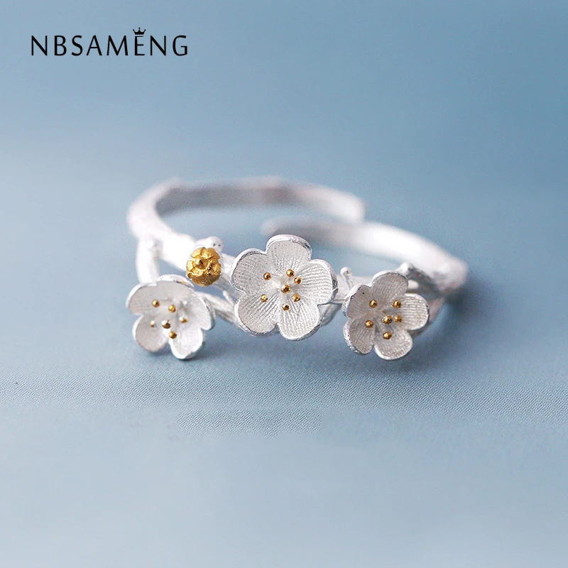 

NBSAMENG The Cherry Blossom Branch Resizable Open Ring In White Copper Silver Plated Medium WAA1016