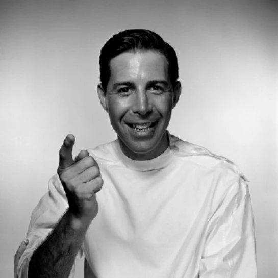 Studio portrait of doctor pointing Poster Print (18 x 24)