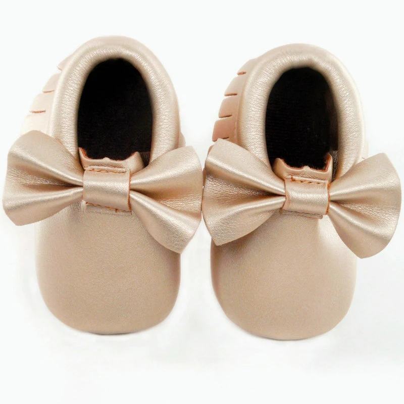 Pair Of Leather Bottom Shoes For A Baby Pair Of Leather Bottom Shoes For A Baby