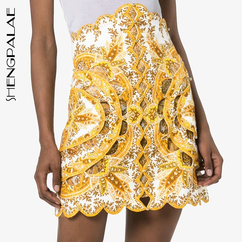 

SHENGPALAE Summer Print Hollow Out Women Skirt High Waist Beading Patchwork Irregular Mini Skirts Female Fashion New 2019 FN890