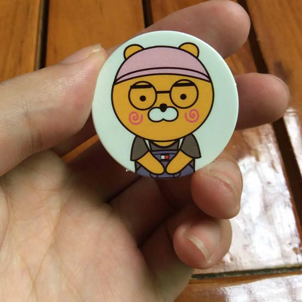 

All new cocoa friends ryan Anti-fall Metal Finger Ring Mobile Phone Support action toy