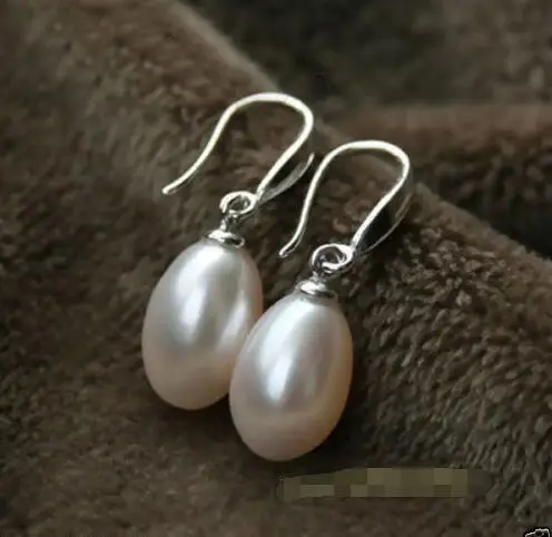 

Free Shipping >>>>Baroque pearls 7X9mm oval white pearl teardrop Solid sterling silver earring