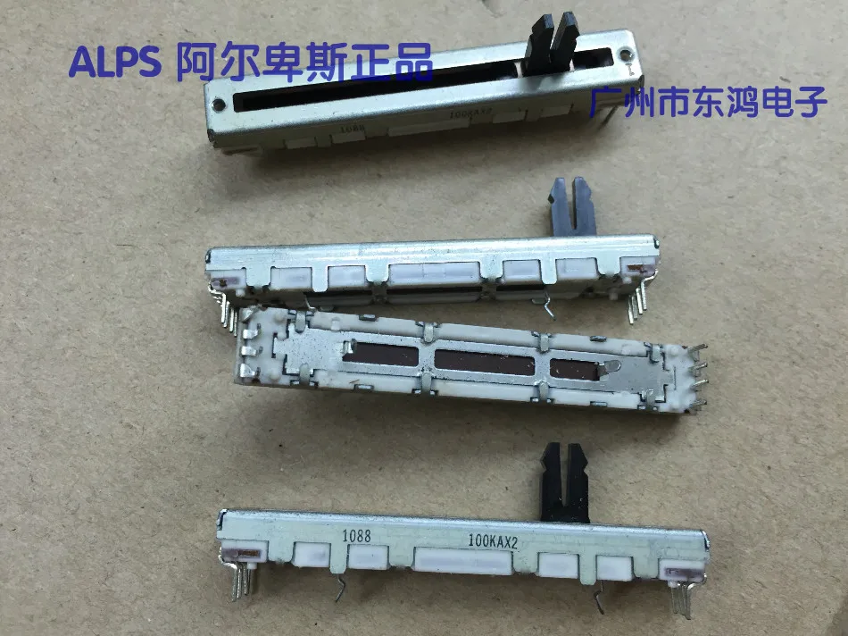 

2PCS/LOT ALPS original authentic brand 6 cm double 10MM axis sliding potentiometer A100KX2 plastic fork shaft