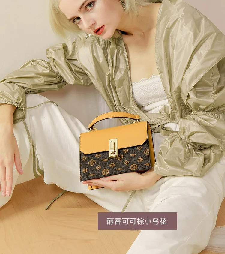 

2 Trend hit color handbag 2019 new female bag exquisite lock hit color stitching shoulder oblique bag handbag B0245JJ 190501 yx