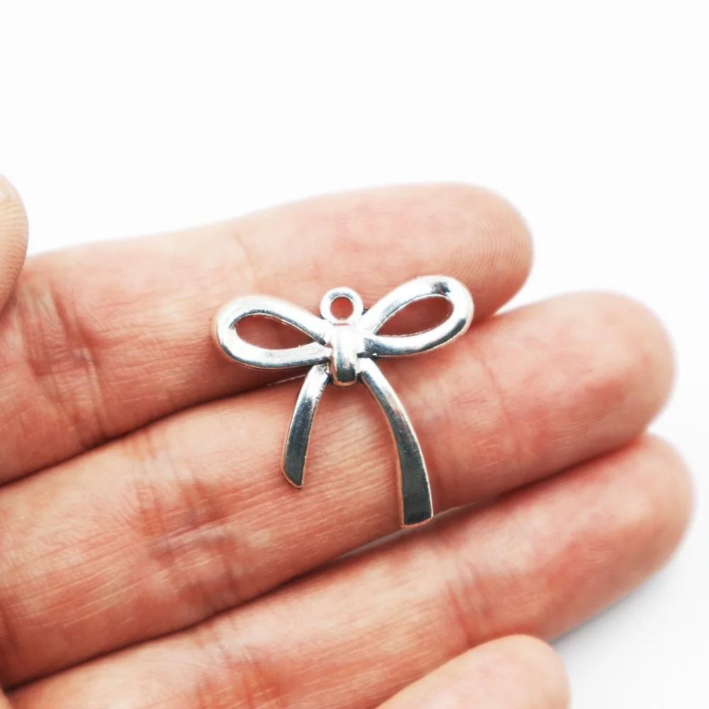 

Hot sell 18pcs metal antique silver charms bow tie charms pendant for necklace jewelry findings