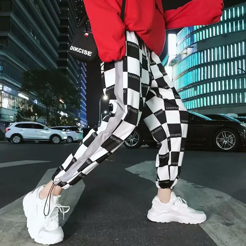 

Korean Version of Men and Women with The New Style Plaid Waist Casual Pants Reflective Strip Loose Harlan Beam Feet Nine Pants