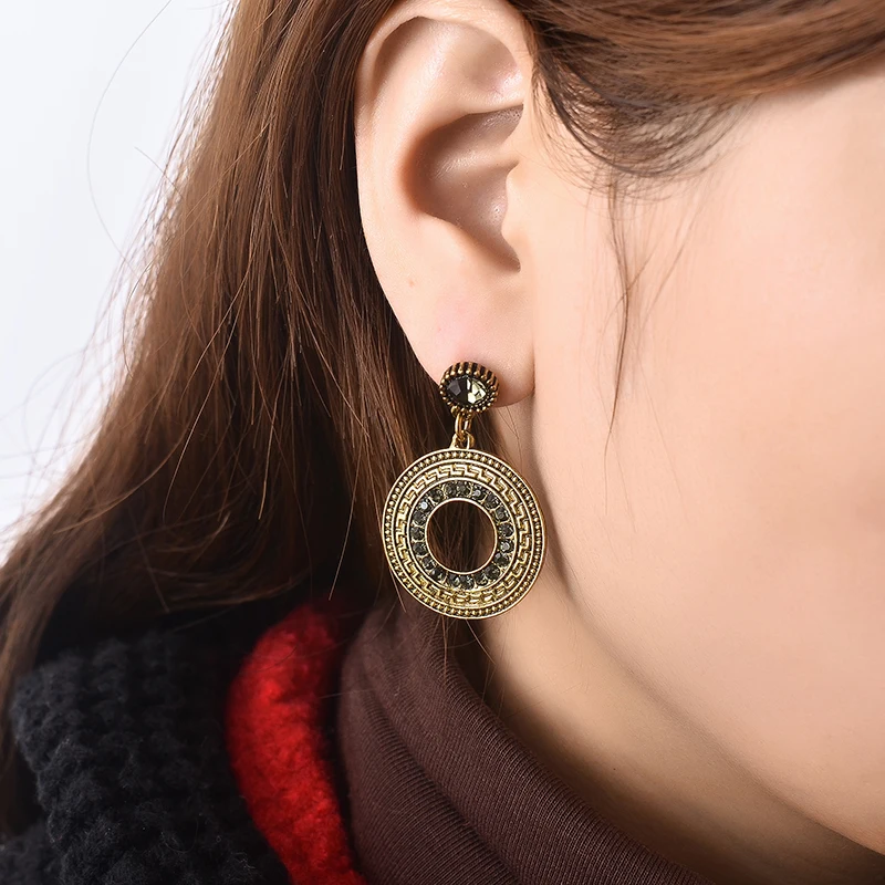 

freeshipping 2017 Bronze crystal round hanging national earrings,fashion women figure style bling Hollow retro jewelry