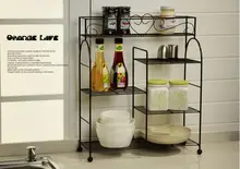 European pastoral, wrought iron shelf in the kitchen. Caster multilayer shelf. Receive bathroom articles for use.