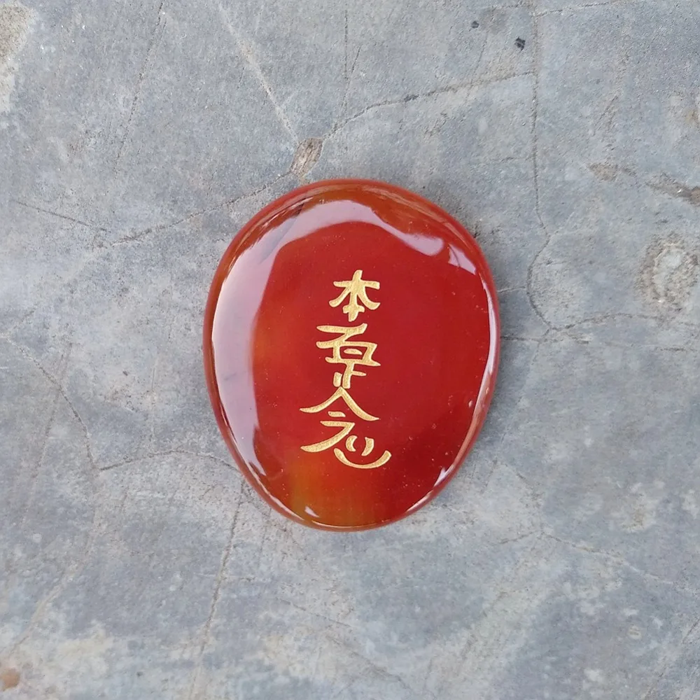 carnelian palm stone reiki symbol