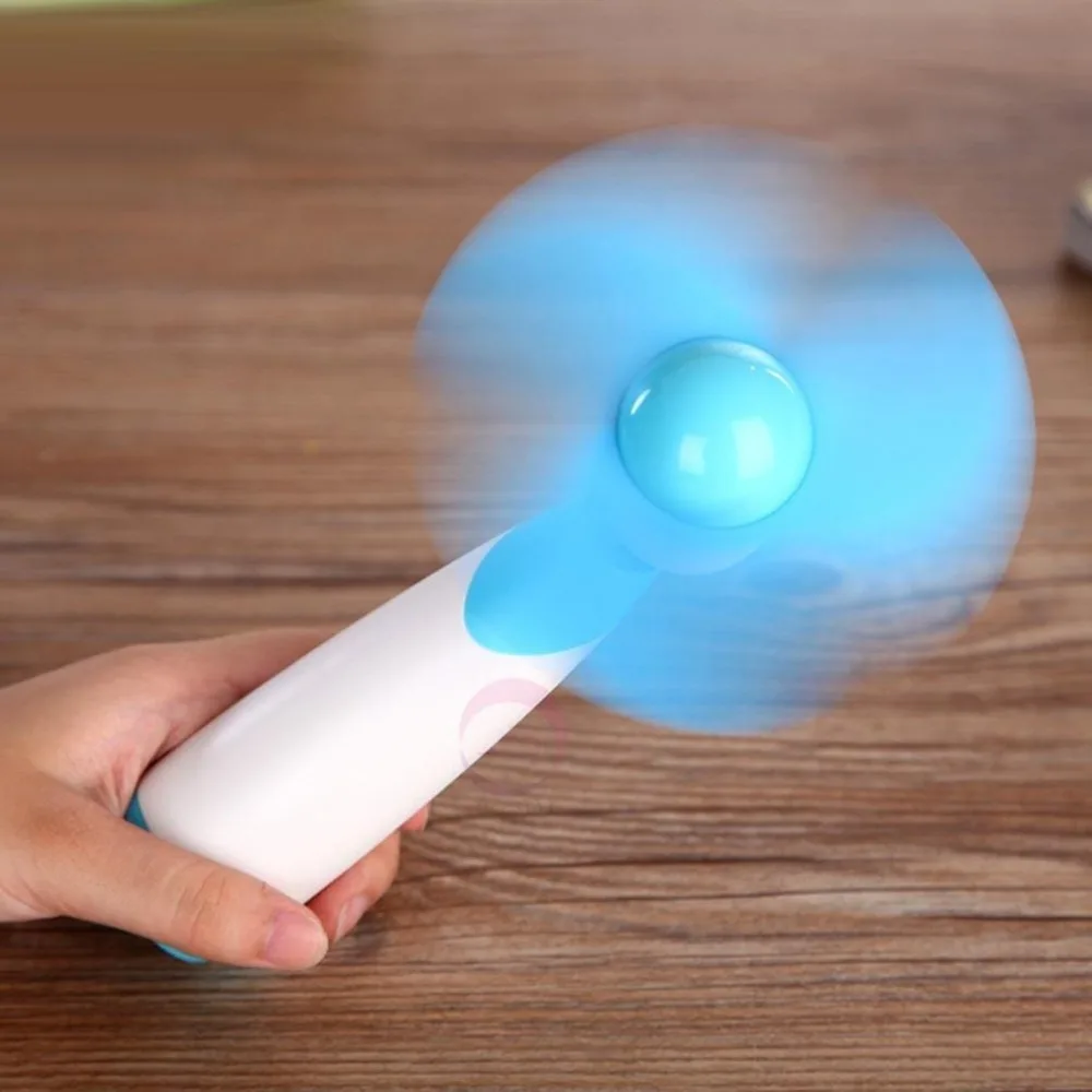 

Mini Fan Super Mute Battery Small Light Compact Colling Fan Powered by Two AA Batteries Handheld Operated Cooler For Cooling