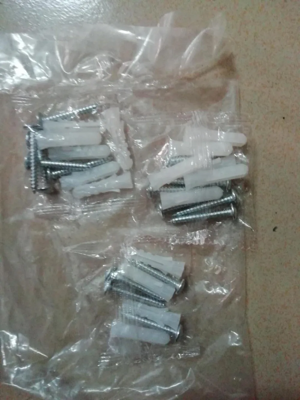 

Screws and anchors for crystal metal holdback