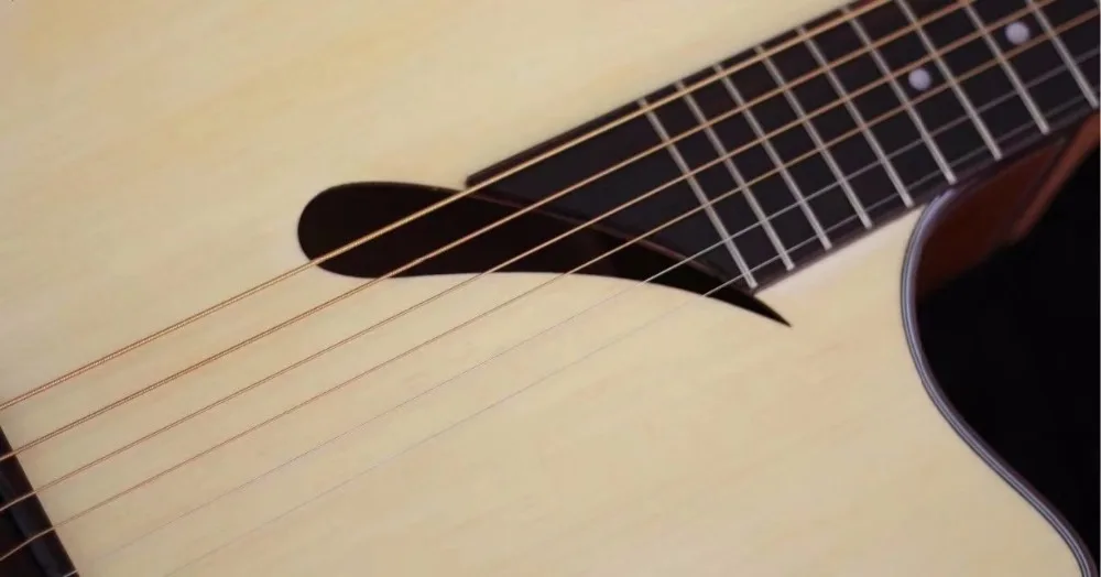 

2018 new acoustic electric guitar comma-shaped sound hole guitar