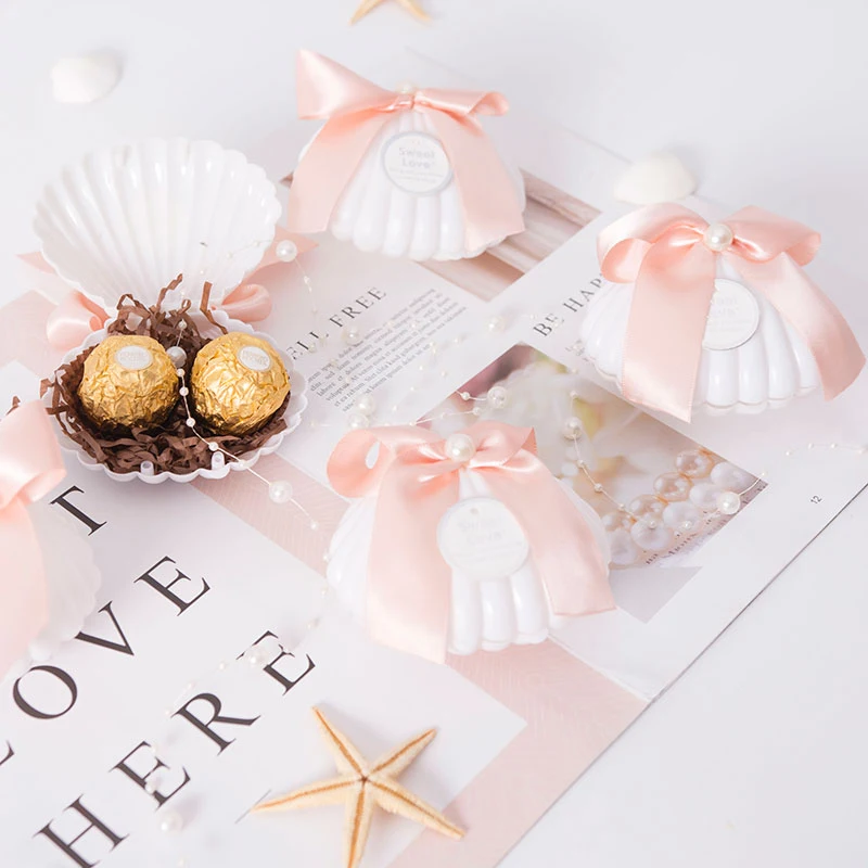 

20Pcs/lot Plastic White Shell Wedding Favors Candy Boxes Chocolate Boxes Creative Peal Knot Shell Gift Box Party Deco Supplies