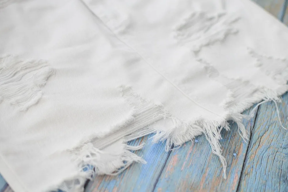 Women's high waist hip half skirt in pure white irregular worn foot tassel spring summer popular wild (17)