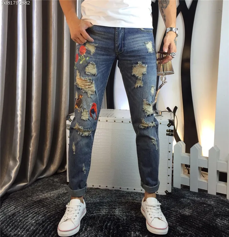 

2017 Euramerican brand jeans men all-match loose hole cat washing blue trousers  EMBROIDERED bird flower pants