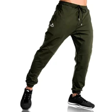 Тренажеры Бодибилдинг для мужчин s Джоггеры для занятий фитнесом повседневные брюки для мужчин Slim Fit Эластичные хлопчатобумажные спортивные брюки для мужчин дропшиппинг