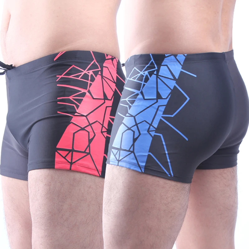 

Matching Color Black and Dark Grey Geometric Imprint Fully lined Elastic adjustable tie Super Quality Swimming trunk for men