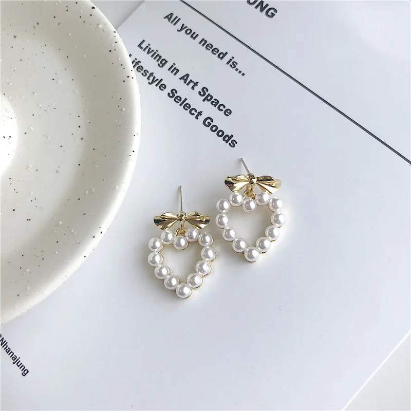 

Handmade ear ornaments bow knot ear nails South Korea sweet girls love heart-shaped pearl earrings ear ornaments A206