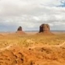 Buttes in a desert  The Mittens  Monument Valley Tribal Park  Monument Valley  Utah  USA Poster Print (20 x 5)