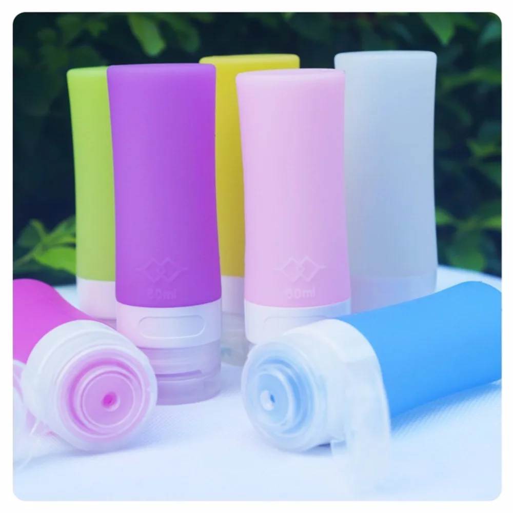 

4 pcs Leakproof Silicone Travel Refilliable Bottles Storage Bottle for Shampoo,Sunblock ,Cream Jar and Toiletries Color Random