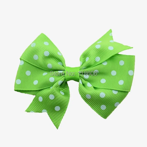 Green Polka dot pinwheel hair bow.jpg