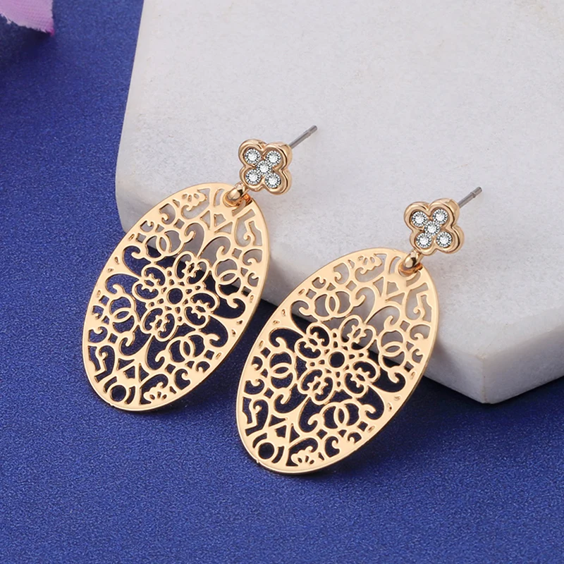 

Hollow Flower Bohemian Copper Stud Earrings for Women Crystal Clover Rose Gold Big Oval Earrings for Women pendientes largos