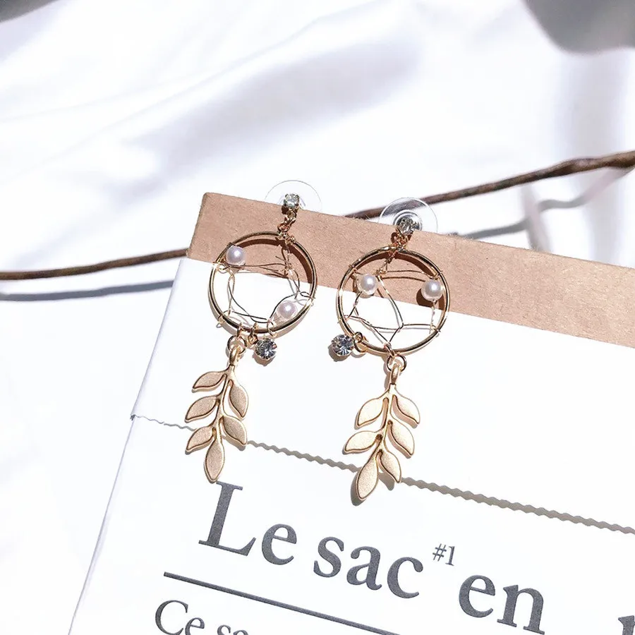 

Korean Personality Pearl Dream Catcher Tassel Earrings Hollow Temperament Pearl Female Earrings Fashion Jewelry