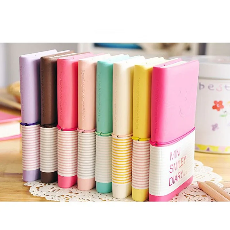 Colores de moda lindo encantador Mini Smiley cuaderno diario de papel para libro de notas de cuero Nota de cuaderno de papelería al por mayor