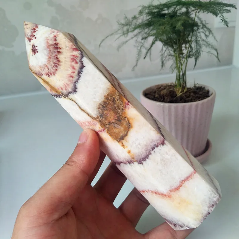 A Oversized stone wand point natural rhododendron crystal decorated obelisk and hexagonal crystal point healing crystals