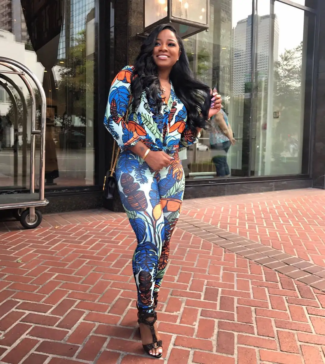 

2018 European and American fashion ladies autumn and winter long-sleeved jumpsuit print sexy buckle jumpsuit