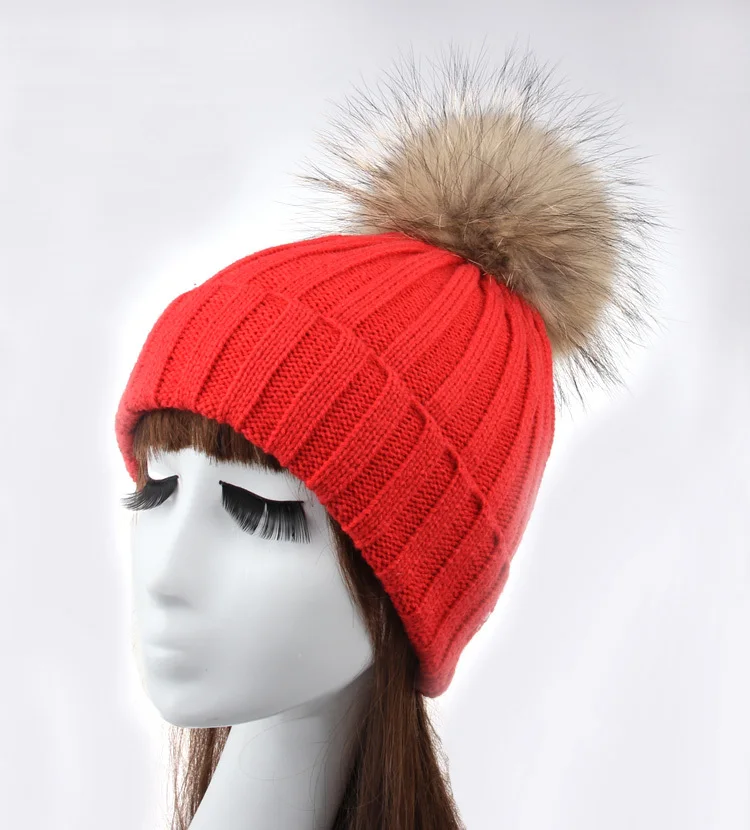 fitted hat with fur ball