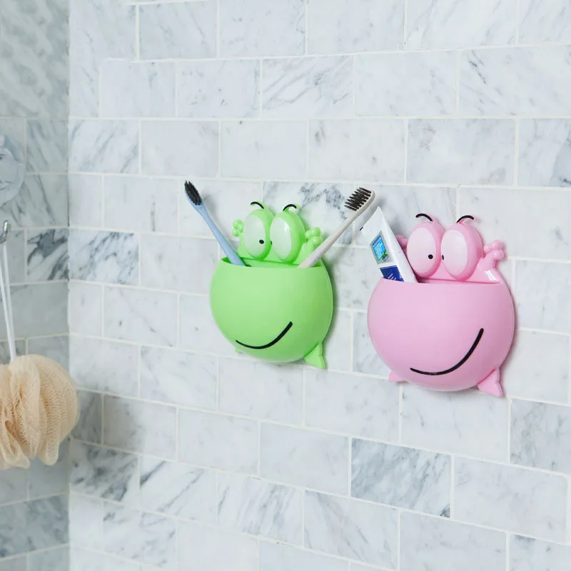 

1 PCS Frog Shaped Toothbrush Rack Cartoon Wall Stick Paste Organizer Bathroom Accessories Strong Suction Toothbrush Holder