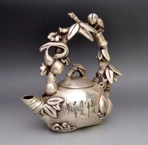 

Asia Collectible Decorated Miao Silver Carved Bird On Grape Tree Tea Pot