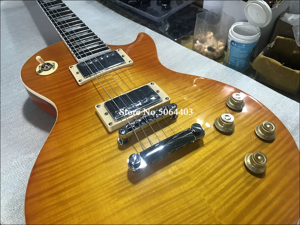 

High-quality 6-string electric guitar, tiger maple veneer, red paint, rosewood fingerboard, real photos, postage