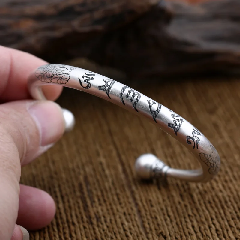 

Wholesale S999 Sterling Silver Jewelry Foot Silver Thai Women Simple Scrub Six Mantra Lotus Open Ended Bangle