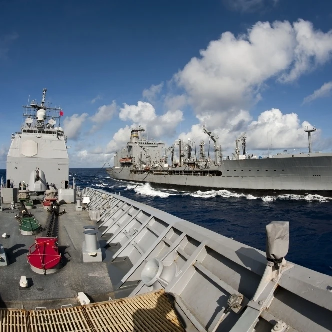 USS Cowpens transits alongside USNS Tippecanoe Poster Print (34 x 22)