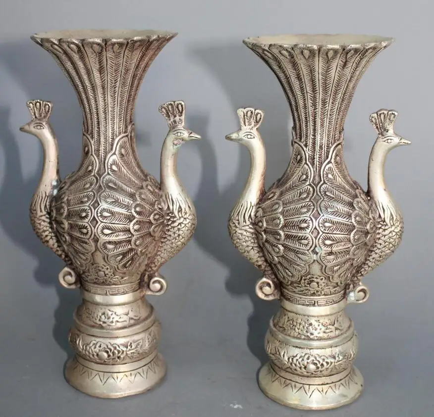 Exquisitely carved Silver Peacock Vase a pair of Statuein Statues