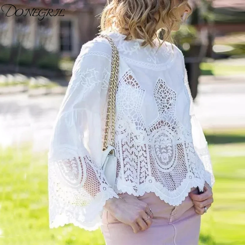 

European and American street women's 2019 spring trumpet sleeves round neck embroidery hollow irregular women's shirt